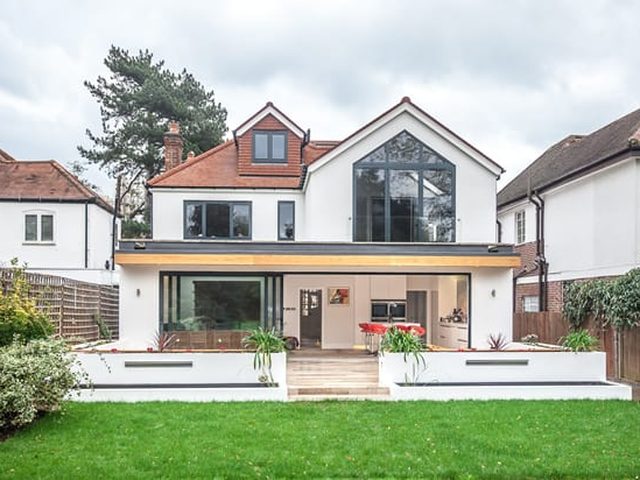 Modern house extension with glass gable and bifold doors