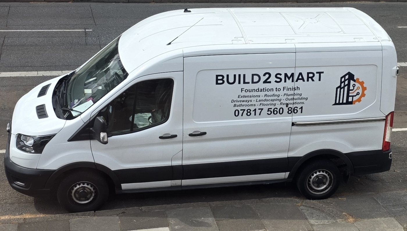 The Build2Smart van, parked on a residential street